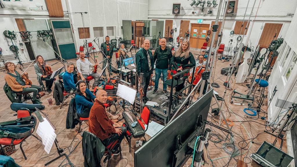Photo courtesy Jennifer Thomas/ Sequim artist Jennifer Thomas, standing on right, works with Brian Vibberts and Anthony Weeden from the conductors podium at Abbey Road Studios in London with its orchestra for Thomas new album Oceans.