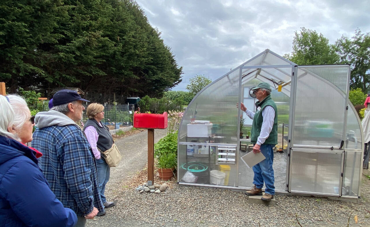 Photo by Dave Eberle
Master Gardener David Rambin explains greenhouse applications for home gardeners at a recent event at the Woodcock Demonstration Garden.