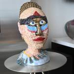 Christian Speidels Love Is Strange started as a wood sculpture but after cracking the artist shifted gears to add mosaic tiles.