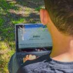 Sequim Gazette photo by Elijah Sussman / Writer Anderson Williams looks at his story Ruthless at Carrie Blake Park on June 6.