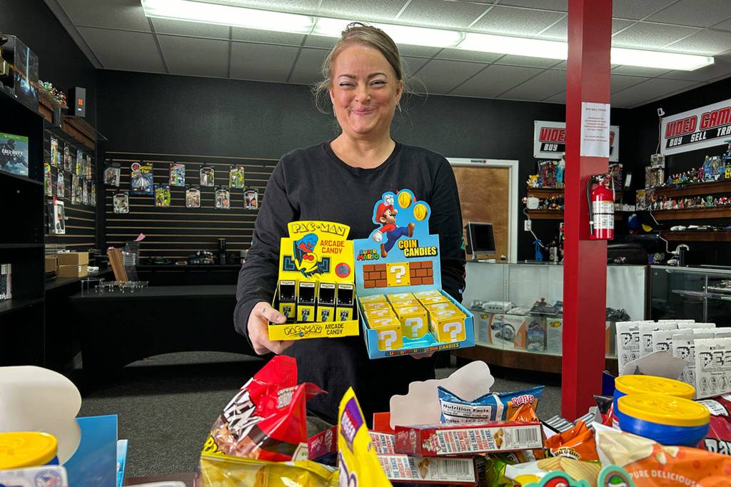 Sequim Gazette photo by Matthew Nash/ Paula Offenheiser shows some of the many game-inspired snacks available in Cardquest Gaming.