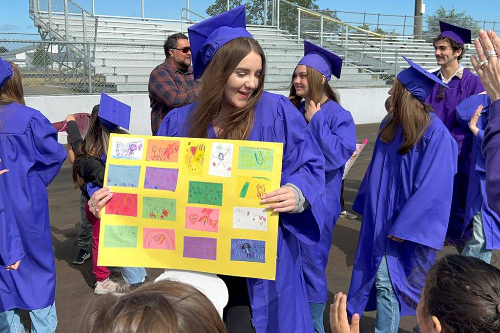 Sequim Gazette photo by Matthew Nash/ Terceira Rosa, a Sequim High School senior, thanks students for a poster they made for her to celebrate graduating from Sequim High School.