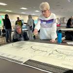 Christine Paulsen, center, talks with her small group about their opinions on how residents priorities for Sequim affect transportation, water preservation, and more. Paulsen was one of dozens of people to participate over three days/nights for a City of Sequim Comprehensive Plan workshop. There are so many things we can do to make this a wonderful place to live, she said.