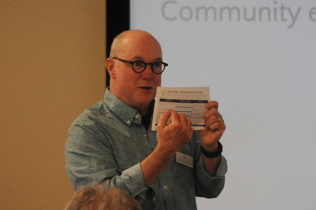 Sequim Gazette photo by Matthew Nash/ William Grimes, principal with SCJ Alliance, talks to residents on June 13 about a mini-poll that offers residents a chance to share their input on growth policy priorities. Its available online, along with upcoming events and documents at sequimagine.org.