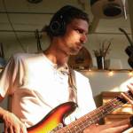 Photo taken by Bergen De Koch / Colin Schmidt tracks basslines in Port Townsends Rainshadow Recording Studio in September 2022.