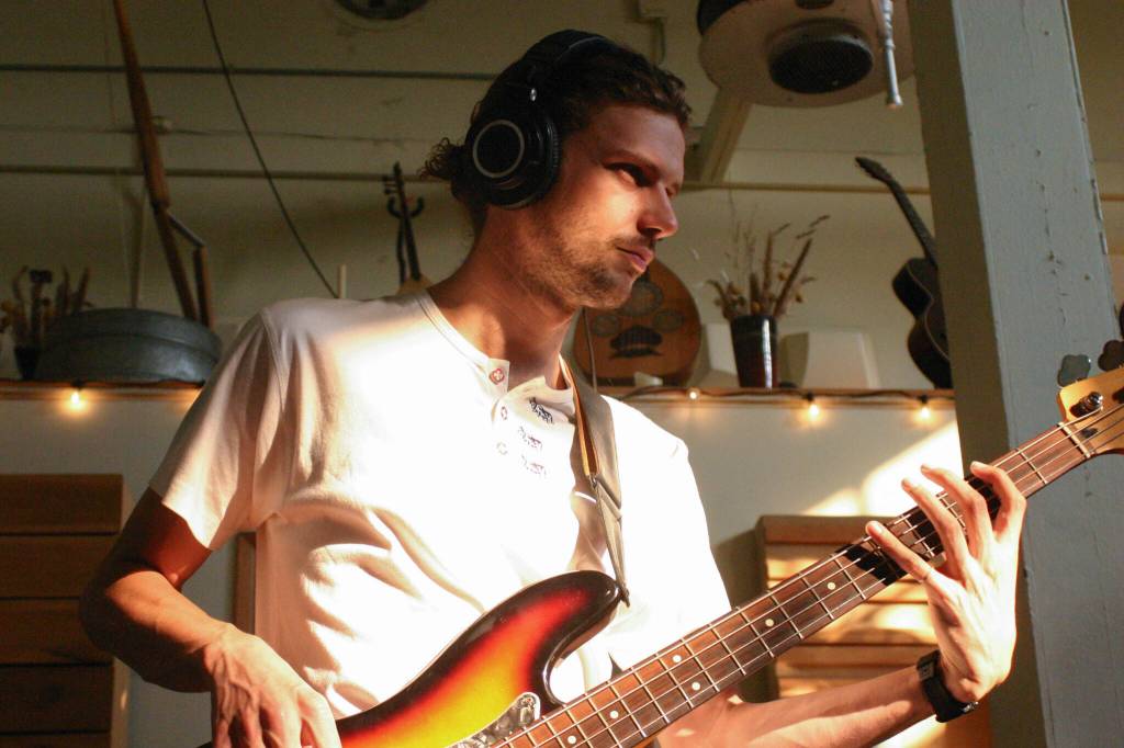 Photo taken by Bergen De Koch / Colin Schmidt tracks basslines in Port Townsends Rainshadow Recording Studio in September 2022.