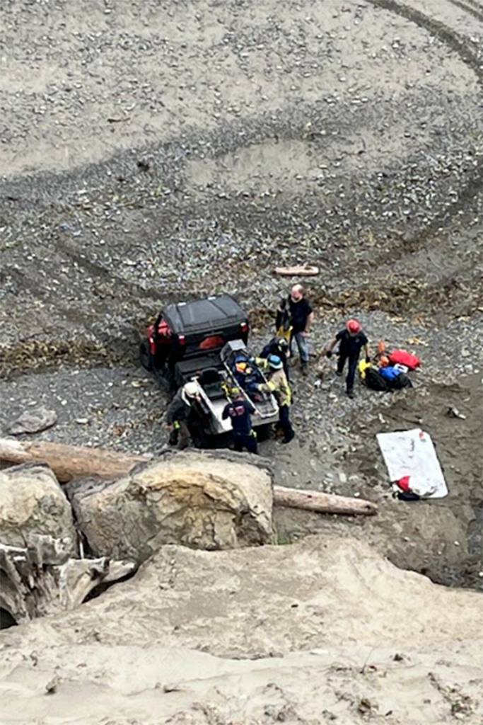 Photo courtesy Clallam County Fire District 3/ Firefighters rappelled down bluffs north of Sequim overlooking the Strait of Juan de Fuca to help a woman who was hurt while looking for her dog that fell.