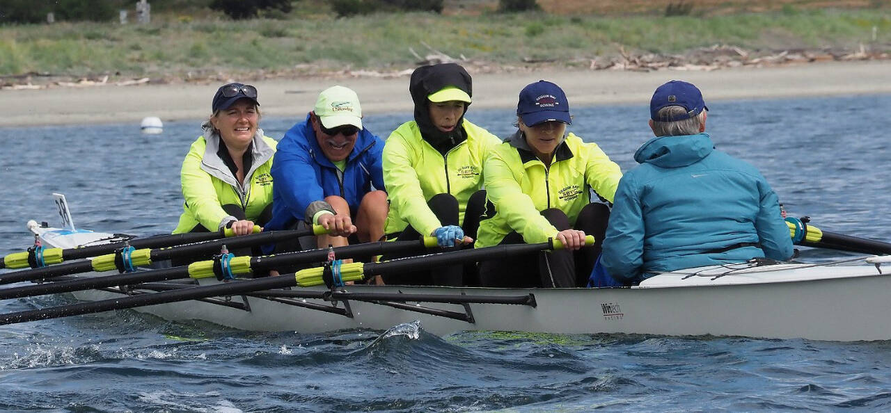Photo by Michael Lampi/Sound Rowers Taking first place in the Open Water Coxed Quad long course division in the June 15 Rat Island Regatta are Sequim Bay Yacht Club rowers (from left) Christi Jolly, Frank DeSalvo, Amy Holms and Jeanne Neal, with Carolyn DeSalvo in the cox seat.