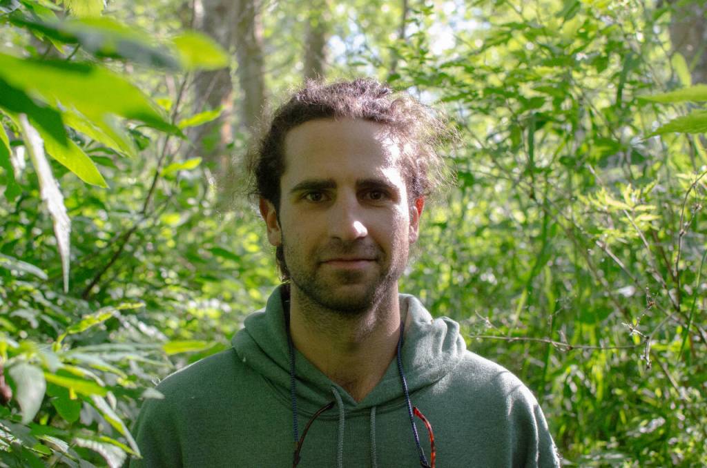 Sequim Gazette photo by Elijah Sussman / Calvin Stokes forges through the thick riparian zone near the Dungeness River on May 29.