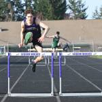 Sequim Gazette photo by Michael Dashiell / Sequim's Adrian Brown races to a first place finish in the 300 meter hurdles at an Olympic League track and field meet in Sequim on March 31, 2021. The meet wound up being the last the Wolves hosted for more than three years after the surface was deemed unsuitable for competition.
