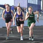 Sequim Gazette file photo by Michael Dashiell / From left, Sequims Anastasia Updike and Mikiah Winter and Port Angeles Lauren Larson break from the starting line in the 1,600-meter race at an Olympic League track and field meet in Sequim on March 31, 2021. The meet wound up being the last the Wolves hosted for more than three years after the surface was deemed unsuitable for competition.