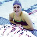 Sequim Gazette file photo by Michael Dashiell / Summer Jackson, pictured here displaying Junior Olympics medals in 2003, is a Sequim Hall of Fame inductee this fall.