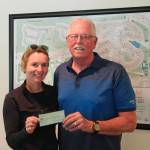 Photo courtesy of Sequim Sunrise Rotary
Eric Mahnerd of Sequim Sunrise Rotary presents a $750 donation to Nicole Lepping, founder of the Sequim Wheelers, to help replace her organizations equipment.