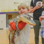 Alex Lerseth shares a moment with Lucy, the crocodile.