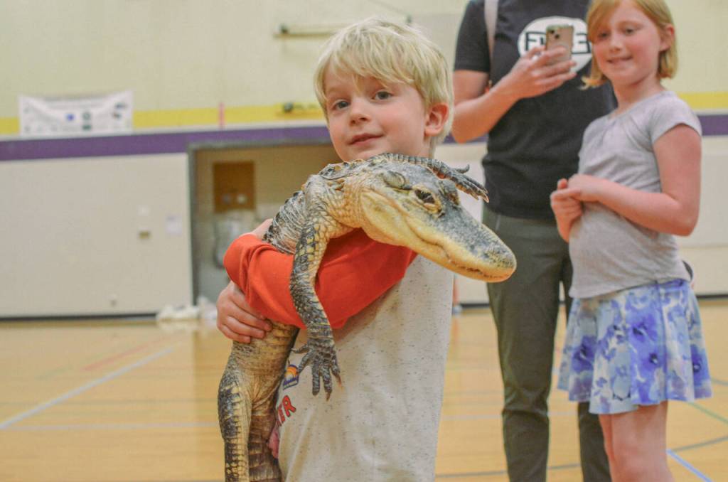 Alex Lerseth shares a moment with Lucy, the crocodile.