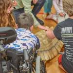 Sequim Gazette photo by Elijah Sussman / Children and parents gather around tortoise on June 25.