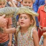 Sequim Gazette photo by Elijah Sussman / Cora Svik poses with Lucy the crocodile on June 25.
