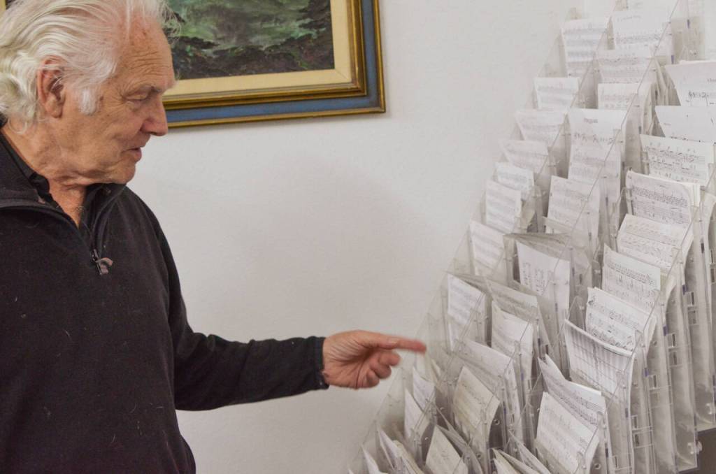 Sequim Gazette photo by Elijah Sussman / Paul Creech with a stand of scores he composed.
