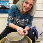 Photo courtesy of Janet Piccola / Potter Janet Piccola, pictured here at the wheel, is one of the featured artists at the Blue Whole Gallery in August, along with Jolene Sanborn.