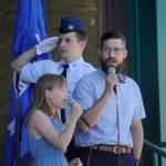 Sequim Gazette photo by Michael Dashiell
Evelyn and Lucas Fennell sing The Star Spangled Banner as Cadet Airman 1st Class Izaak Cameron La Tourette (background) and fellow Civil Air Patrol-Dungeness Unit cadets present the colors at the City of Sequims 2024 Independence Day Celebratio.