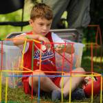 Sequim Gazette photo by Michael Dashiell
Henry Spooner, almost 6, of Sequim, concentrates on building a structure at the North Olympic Library Systems booth during the Sequim Independence Day Celebration.