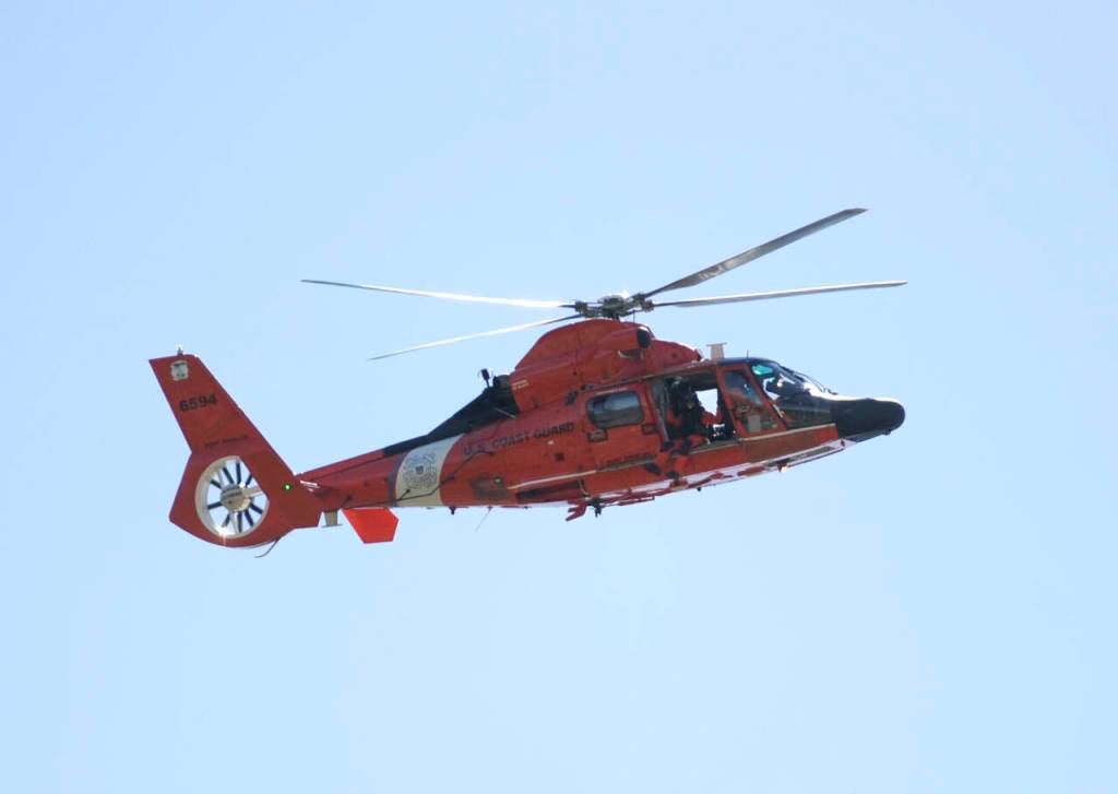 Sequim Gazette photo by Michael Dashiell
A crew from the U.S. Coast Guard Station Port Angeles soars over Carrie Blake Community Park during the Sequim City Bands rendition of the Armed Forces Salute during the City of Sequims Independence Day Celebration on July 4.