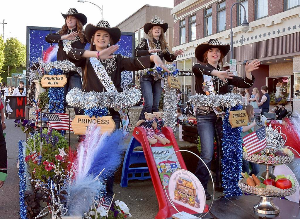 Photo by Keith Thorpe/Olympic Peninsula News Group
Clallam County Fair royalty, from left, Princess Aliya Gillett of Forks, Princess Tish Hamilton of Port Angeles, Queen Brooklyn McKnight of Port Angeles and Princess Olivia Ostlund of Sequim, ride on their float on July 4 in Port Angeles.