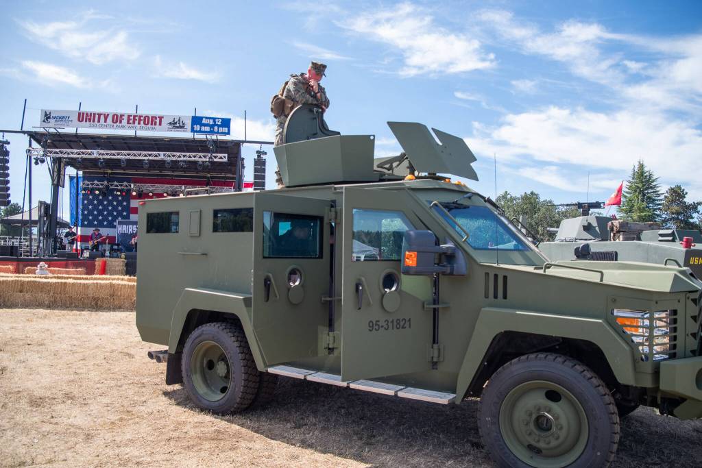 Sequim Gazette file photo by Emily Matthiessen
A member of the United States Marine Corps Security Forces keeps watch while the Buck Ellard Band performs during the Unity of Effort event in 2023. The annual event is billed as a chance for the community to thank first responders and military professionals that keep communities and the nation safe and hosted by Security Services Northwest Inc. and Fort Discovery, Inc.
