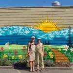 Photo courtesy of Uptown Arts District
Emily Little, left, owner of Buena Luz Bakery in Port Angeles, joins artist Gianna Andrews in front of a new mural in the Uptown Arts District in Port Angeles. A Mural Launch Party is set for July 27.
