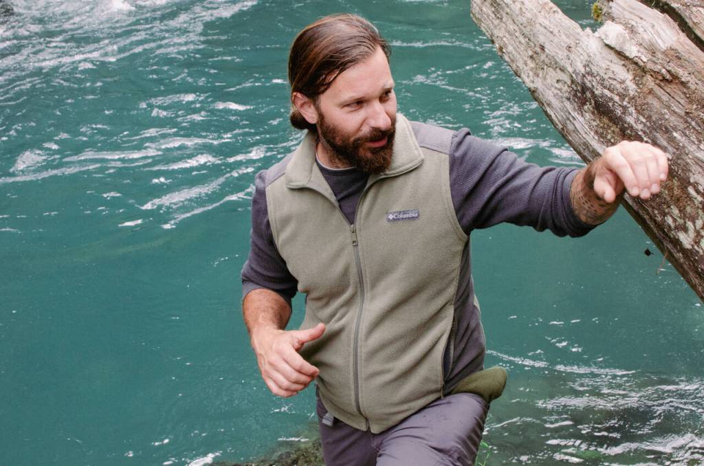 Sequim Gazette photos by Elijah Sussman / David Brownell stands over a deep section of the Dungeness River at what remains of Clink Bridge on June 28.