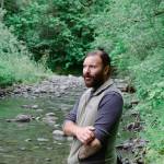 Sequim Gazette photo by Elijah Sussman / David Brownell stands near a side channel of the Dungeness River on June 28.