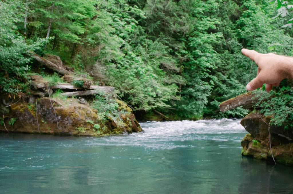 Sequim Gazette photo by Elijah Sussman / David Brownell points to the old bridge that once stretched across the Dungeness.