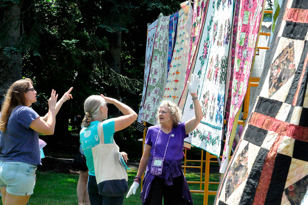 Sequim Gazette photo by Matthew Nash
Bernadette Shein helps answer quilt questions for visitors of the Sunbonnet Sue Quilt Clubs annual quilt show in 2023. This year, the event moves to Trinity United Methodist Church and expands to two days, July 19-20.