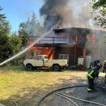 Photo by Paul Lang, CCFD3
A house is deemed a total loss after a fire erupted on July 10 off Palo Alto Road. Firefighters with Clallam County Fire District 3 and Department of Natural Resources fought the house fire and a brush fire.