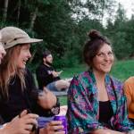 Sequim Gazette by Elijah Sussman / Attendees (from left) Amelia Depue, Angela Schnelle, Dani Carson, and Theresa Kim enjoy golden hour before before Kate Davis on July 6.