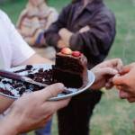 Sequim Gazette photo by Elijah Sussman / Following set, Pistil band members invite the audience to join in wishing their guitarist Matt Mkay a happy birthday on the stage. Afterward, band friends shared cake and cigarettes.