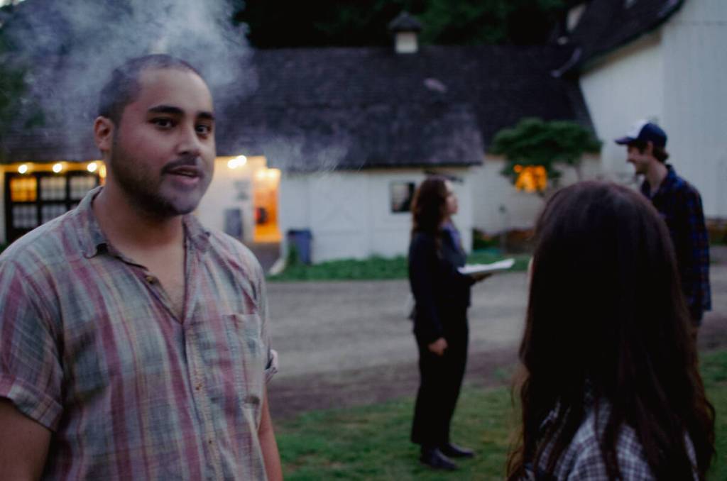 Sequim Gazette photo by Elijah Sussman / Drummer Adam Amr of Port Townsend relaxes after playing two sets on July 4 with Caro Kann and Pistil. He would drum for Seattle artist Margaux on July 6.