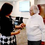 Sequim Gazette photo by Michael Dashiell
Marylaura Ramponi, right, speaks with Sequim School District superintendent Regan Nickels following the July 15 board meeting. Facilities naming committee members were unanimous in accepting Ramponis $1 million donation for the districts vocational education center.