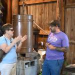 Sequim Gazette photo by Michael Dashiell / Carol Wheeler of Everett, talks with B&B Family Farm co-owner Zion Hilliker during the Lavender Weekend on July 20.