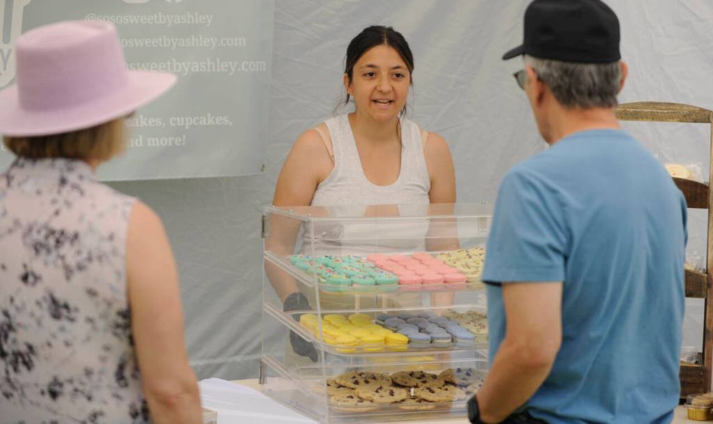 Sequim Gazette photo by Michael Dashiell / Ashley Bell of So So Sweet By Ashley talks with visitors at Jardin du Soliel Lavender Farm & Gift Shop on July 19.