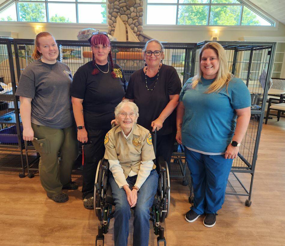 Photos courtesy of Dungeness Courte Memory Care
Annie Gilbert, a resident at Dungeness Courte Memory Care during Annies Pet Adoption Day on July 12 with (from left) Liv Carlson, Michelle Parsons, Dr. Pamela Bundy and Michelle Gentry.