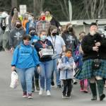 Olympic Peninsula News Group photo by Keith Thorpe/ Bagpiper Erik Evans of Port Angeles, right, leads children and staff members, including CEO Mary Budke down Francis Street from the old clubhouse of the Port Angeles Unit of the Boys & Girls Club to the new Turner Clubhouse on its first day of occupancy on March 5, 2021.