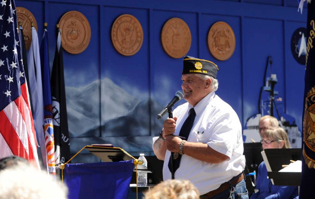 Sequim Gazette photo by Michael Dashiell / American Legion post Commander Carl Bradshaw speaks at the unveiling of the Remember Me mural in Sequim on July 20.