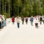 Photo by Dave Logan/for Olympic Peninsula News Group / Lower Elwha Klallam Tribal Chairwoman Francis Charles leads tribal members in a ceremony across the length of the new Elwha River bridge, which July 21. The tribal members dedicated the surface with cedar bows as members of the bridge crew watched from left.