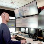 Keith Thorpe/Olympic Peninsula News Group
Communications officer Ian Harrington oversees a bank of computer screens at the Peninsula Communications emergency dispatch center in Port Angeles on July 24.