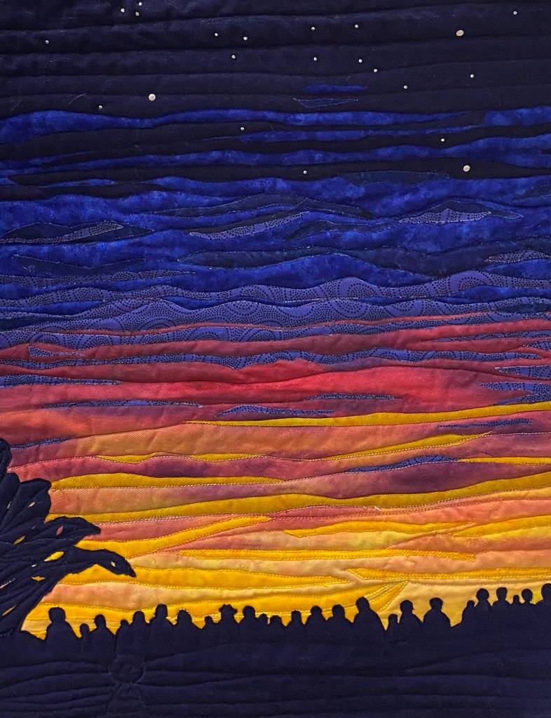 Artwork courtesy of Beverly Beighle
Celebrate the Day by Beverly Beighle, one of the Peninsula Art Quilters whose art is on display in the Judith McInnes Tozzer Art Gallery at the Sequim Museum & Arts in August.