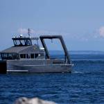 Photo by by Eric Francavilla/Pacific Northwest National Laboratory / The Department of Energys first hybrid research vessel, Resilience, cruises by Sequim Bay on its way to dock at the John Wayne Marina in mid-July. The vessel will operate out of the marina for a few months while PNNL-Sequim is updating its dock.