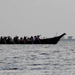 Photo by Teresa Herrera / A canoe team on the Power Paddle to Puyallup Youth Canoe Journey 2024 passes near the New Dungeness Light Station soon after launching from area to Port Townsend on July 26.