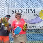 Sequim Gazette photo by Michael Dashiell
Kim Kummer, left, and Donna Salas celebrate a Big Dill pickleball tournament title at the Carrie Blake Community Park courts this past weekend.