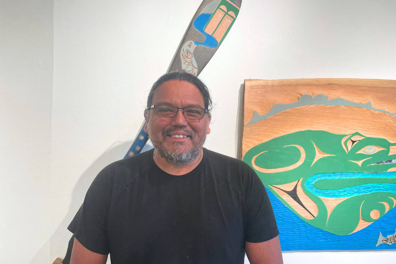Photo courtesy of Port Angeles Fine Arts Center
Featured artist Darrell Charles stands in front of his artwork in the Beauty and Resilience exhibit at the Port Angeles Fine Arts Center. The center hosts a Second Saturday Art Walk from 3-6 p.m. on Aug. 10 at 1203 E. Lauridsen Blvd., Port Angeles.